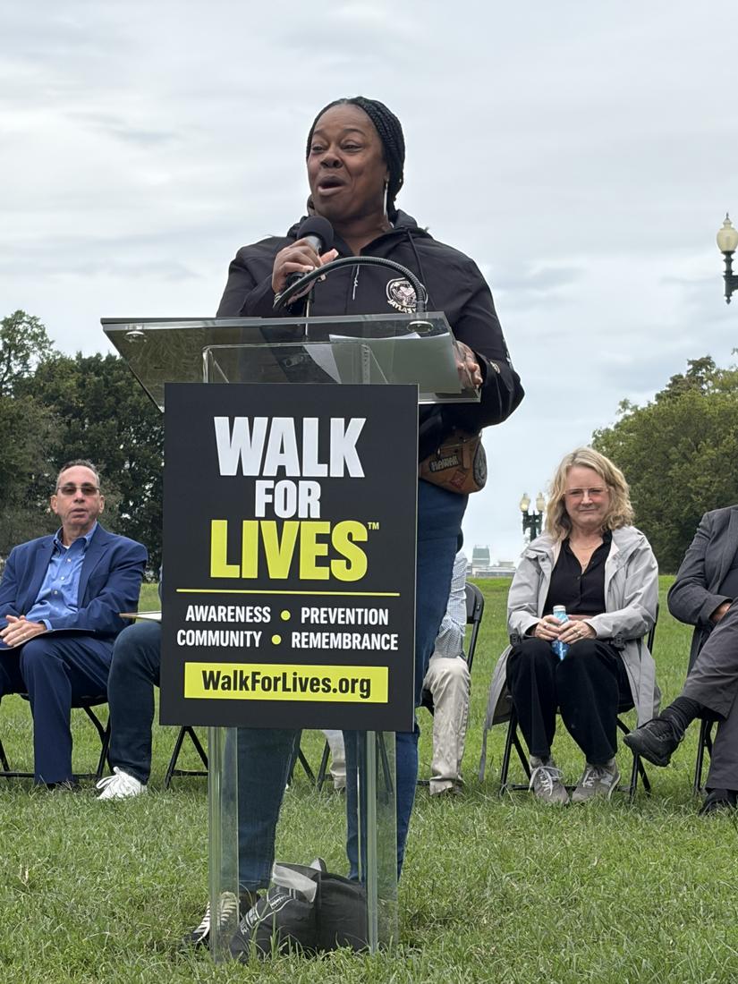 A walk leader speaks at the Walk for Lives podium in Washington, D.C.